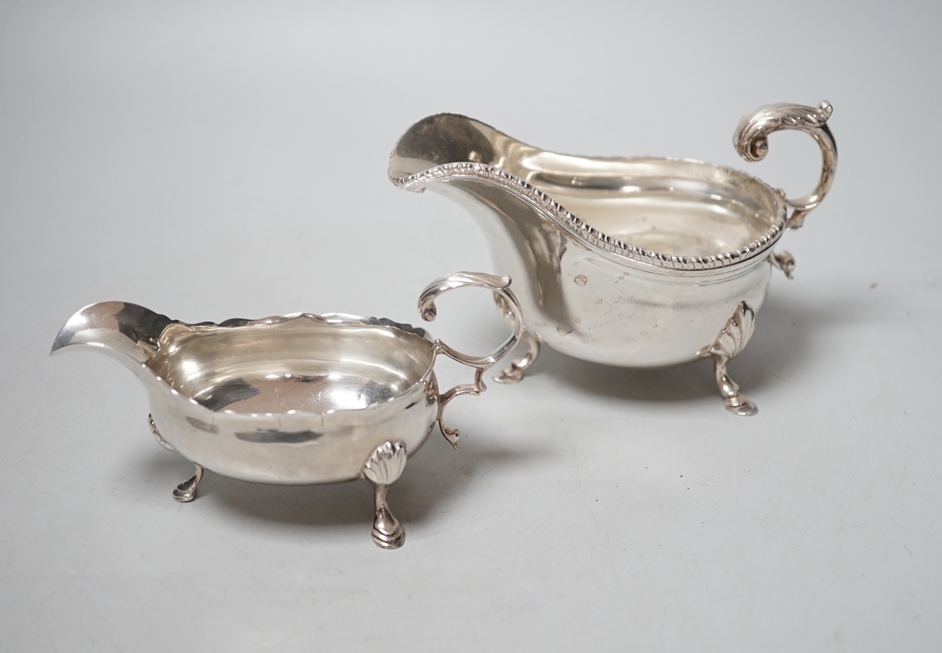 A George III silver sauceboat, London, 1759 and a later sauceboat, 10.8oz.